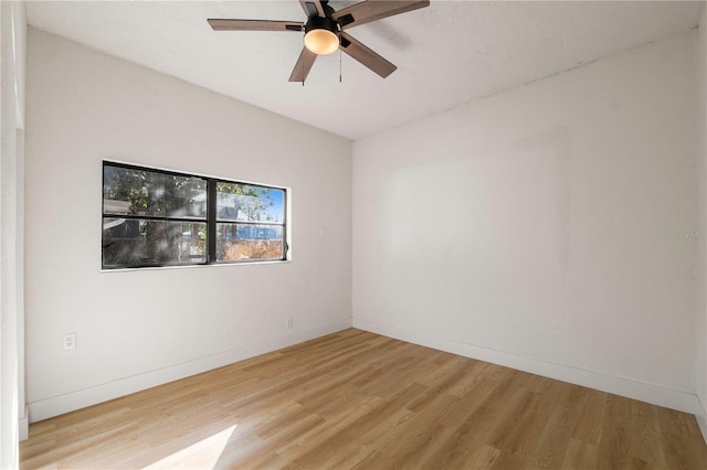 empty room featuring light hardwood / wood-style flooring and ceiling fan