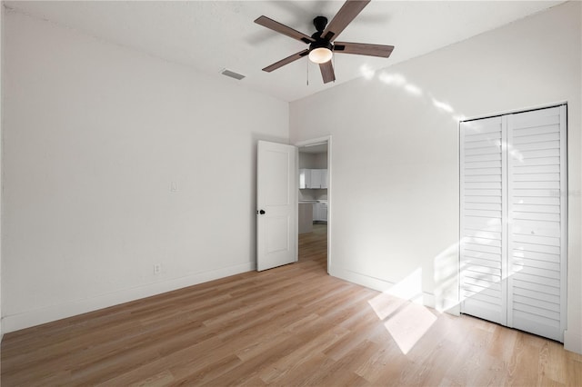 unfurnished bedroom with a closet, ceiling fan, and light hardwood / wood-style flooring