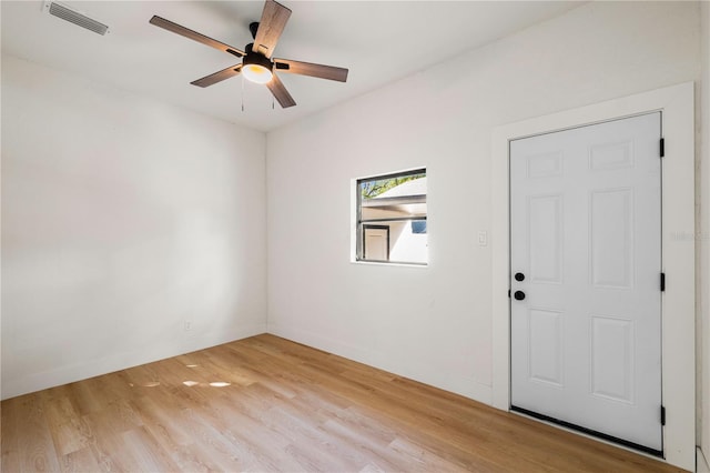 spare room with ceiling fan and light hardwood / wood-style floors