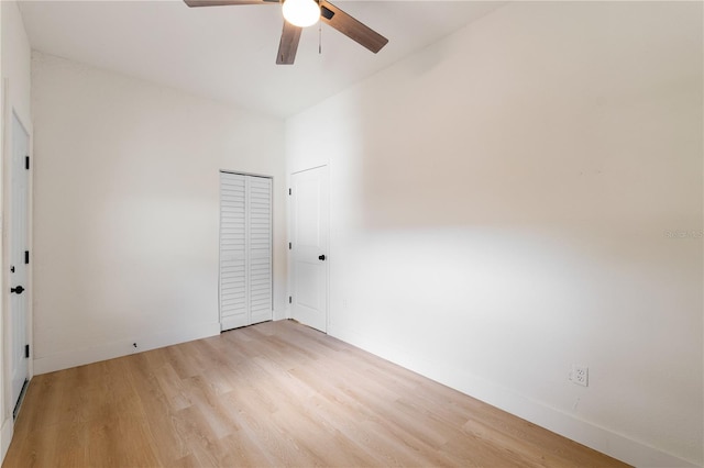 empty room featuring ceiling fan and light wood-type flooring