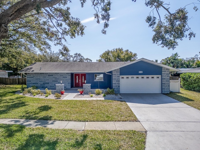 ranch-style house featuring a garage and a front lawn