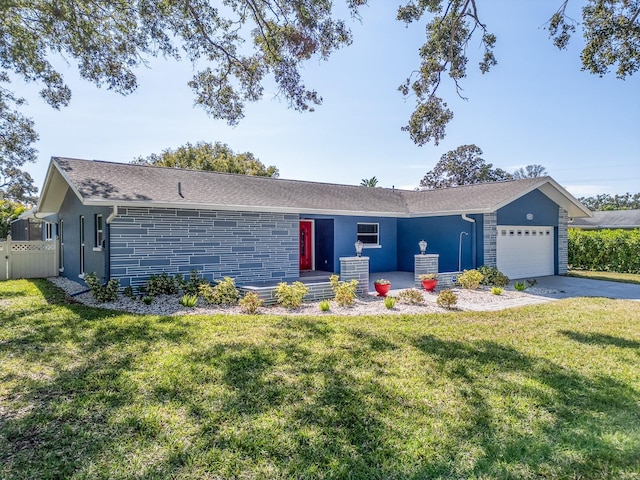 single story home with a garage and a front lawn