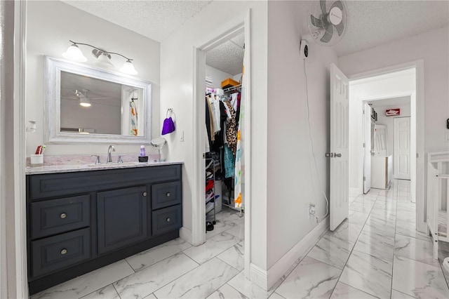 bathroom featuring vanity and a textured ceiling