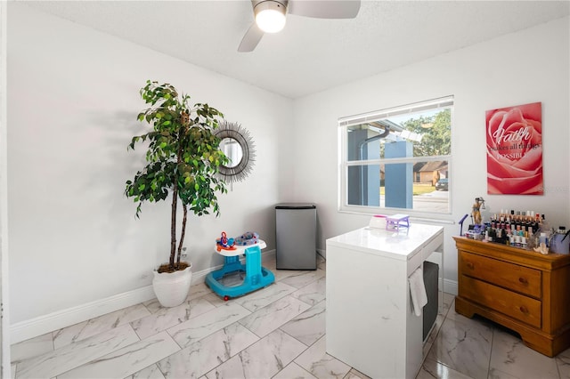 office space with ceiling fan and a textured ceiling