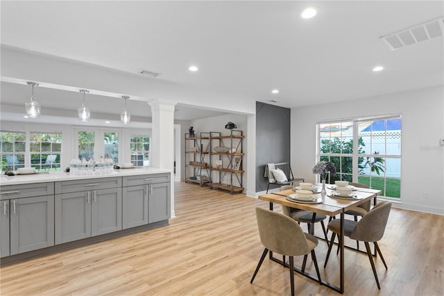 dining space featuring recessed lighting, visible vents, and light wood finished floors