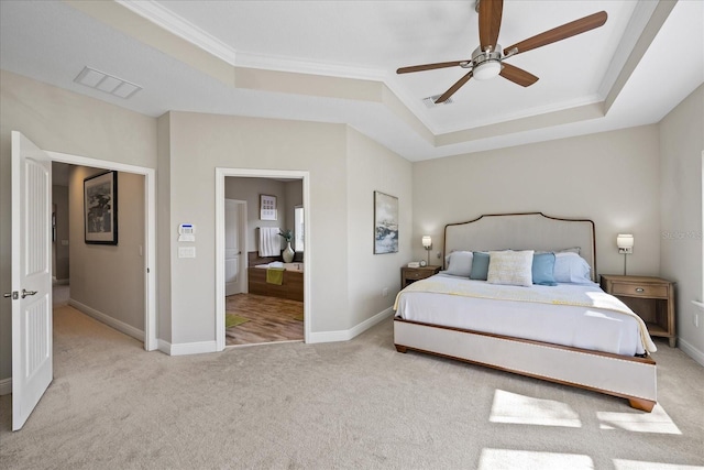 carpeted bedroom featuring ceiling fan, ornamental molding, and a raised ceiling