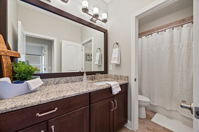 bathroom with tile patterned flooring, vanity, curtained shower, and toilet