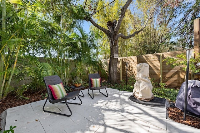 view of patio featuring a grill