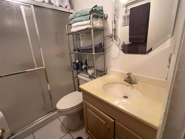 full bath with tile patterned floors, a shower stall, toilet, and vanity