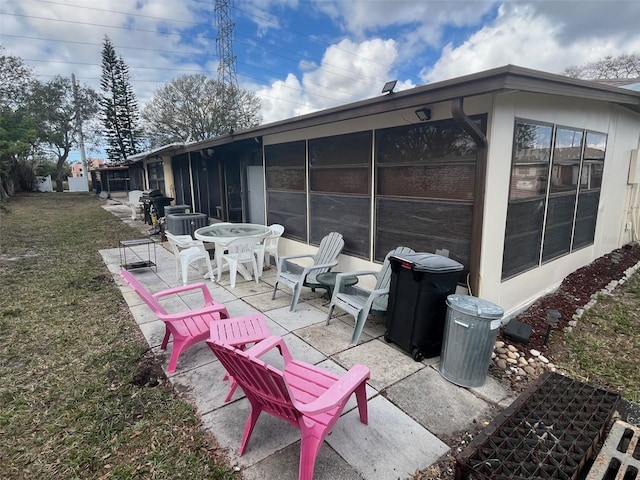 view of patio / terrace with a sunroom