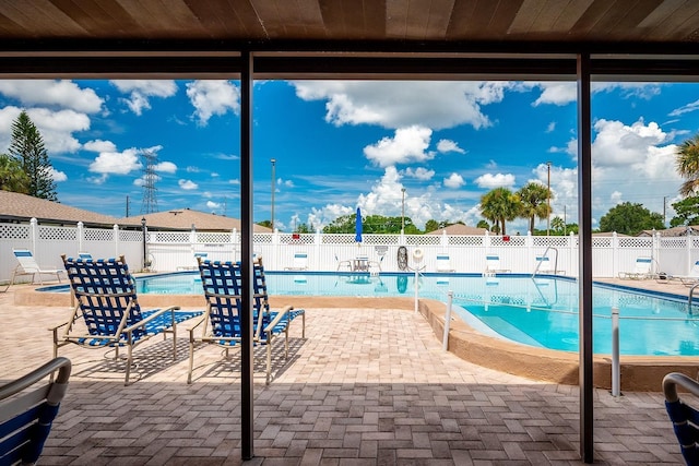 pool featuring a patio area and a fenced backyard