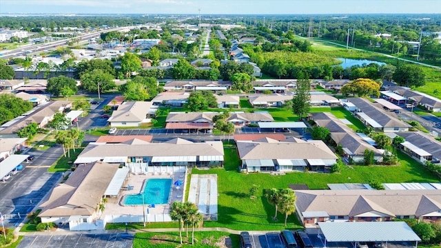 drone / aerial view featuring a water view and a residential view