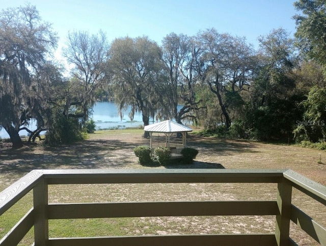 view of yard with a gazebo and a water view