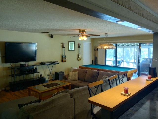 playroom featuring ceiling fan, hardwood / wood-style flooring, billiards, and a textured ceiling