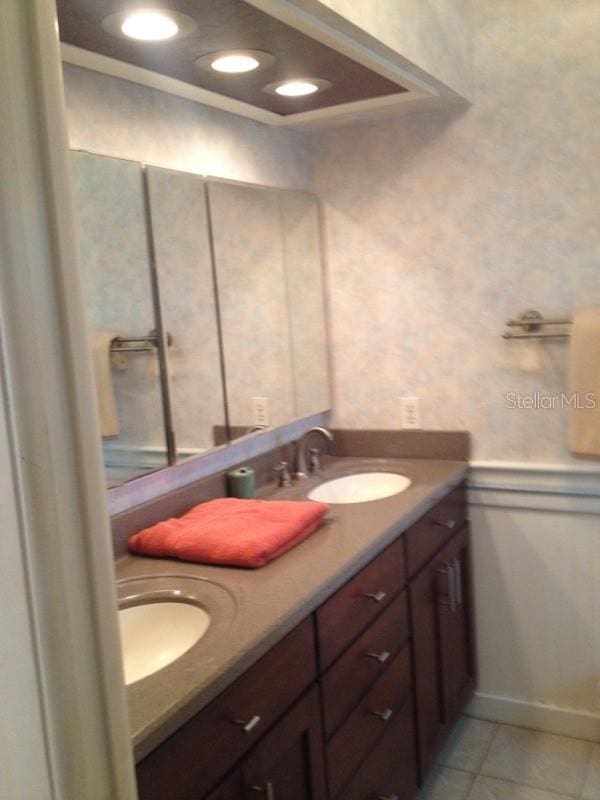 bathroom with vanity and tile patterned flooring