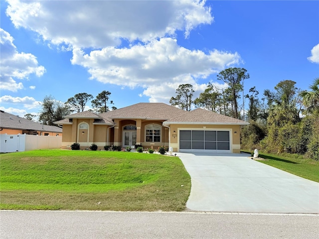 view of front of home featuring a garage and a front yard