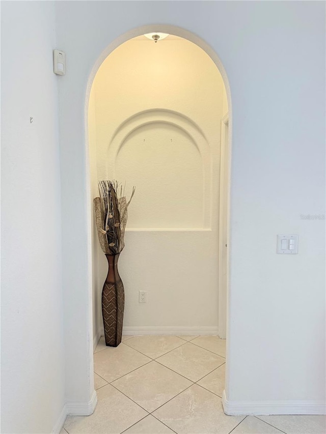 corridor featuring light tile patterned flooring