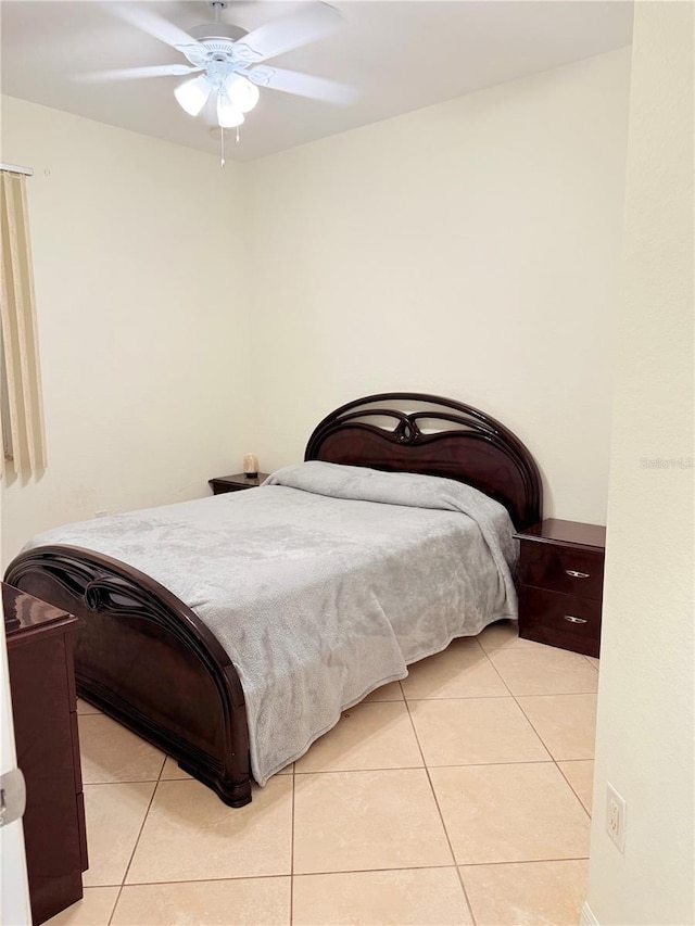 bedroom featuring light tile patterned flooring and ceiling fan