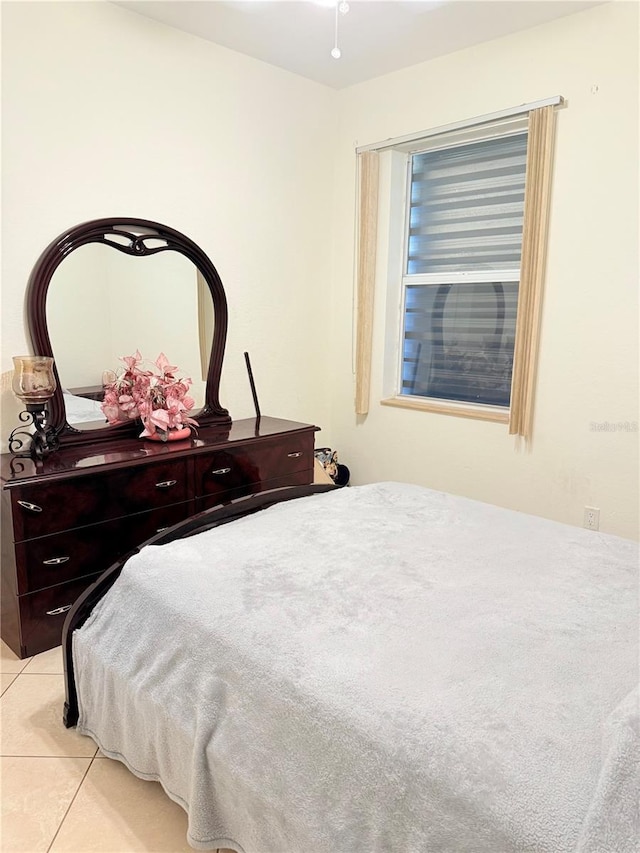 bedroom with light tile patterned floors