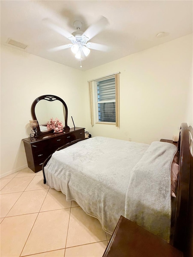 bedroom featuring light tile patterned floors and ceiling fan