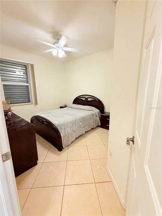 bedroom featuring ceiling fan and light tile patterned floors