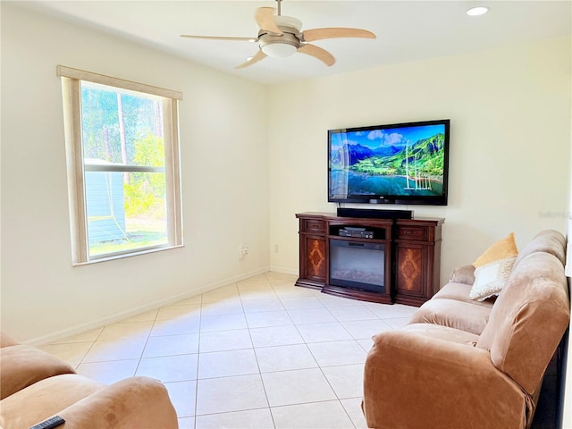 tiled living room featuring ceiling fan