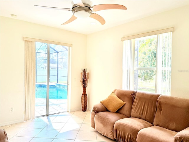 living room with light tile patterned flooring and ceiling fan