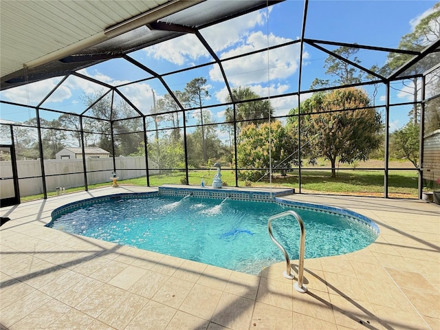 view of pool with a yard, a lanai, and a patio area