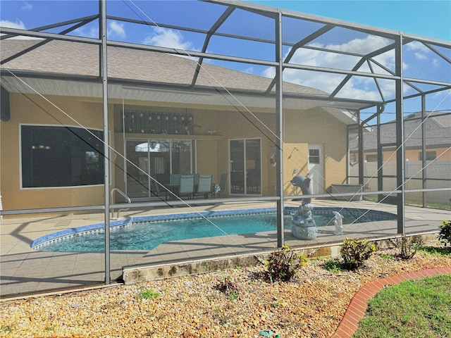 view of pool with a lanai and a patio