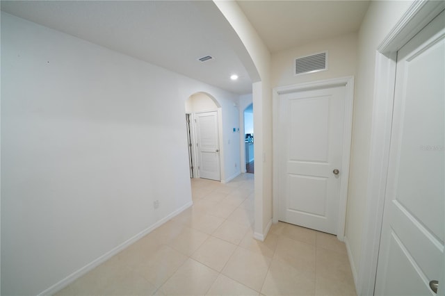 hallway featuring light tile patterned floors