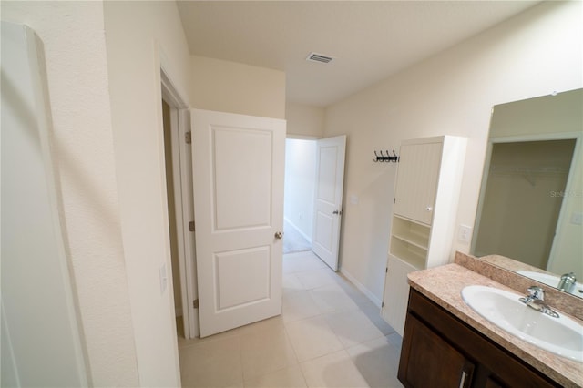 bathroom featuring vanity and tile patterned flooring