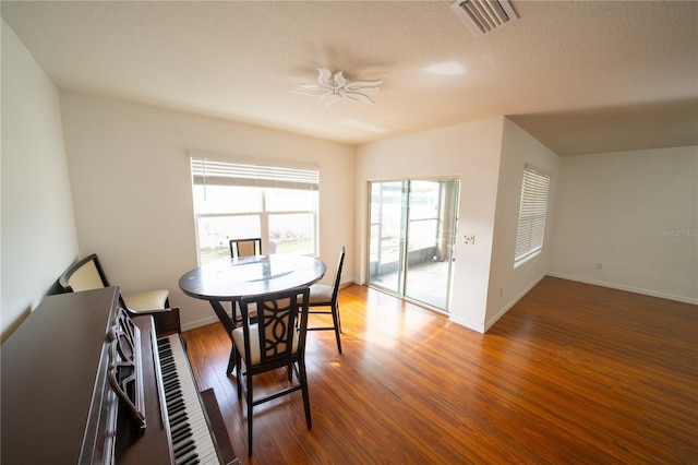 dining room featuring ceiling fan and hardwood / wood-style floors