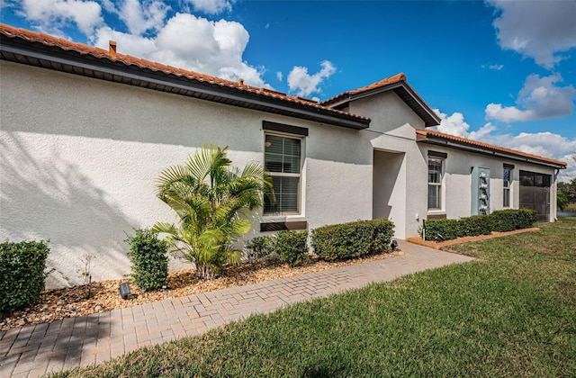 view of property exterior featuring a yard