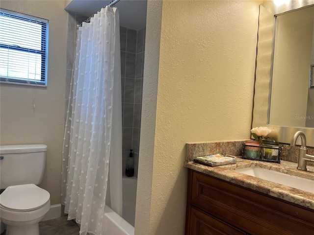 full bathroom with toilet, vanity, and shower / tub combo