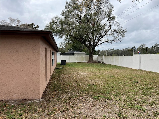 view of yard with central air condition unit