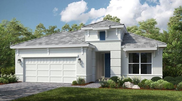 front facade featuring a garage and a front lawn