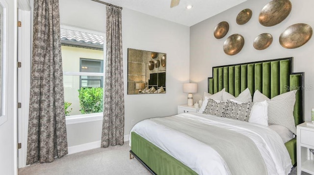 carpeted bedroom featuring ceiling fan