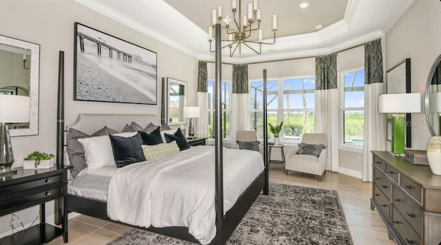 tiled bedroom with crown molding, a tray ceiling, and a chandelier