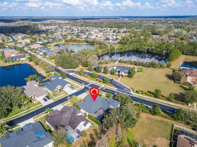 birds eye view of property with a residential view and a water view