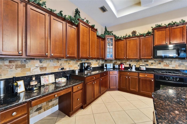 kitchen with dark stone countertops, backsplash, and black appliances