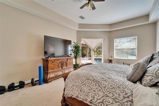 carpeted bedroom featuring ceiling fan and access to outside