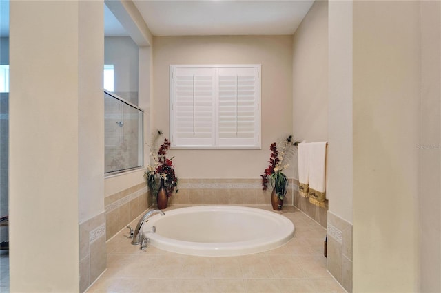 bathroom featuring tiled bath