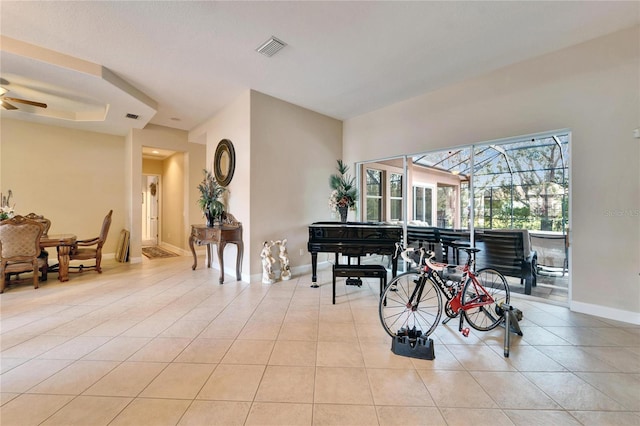 tiled dining space with ceiling fan