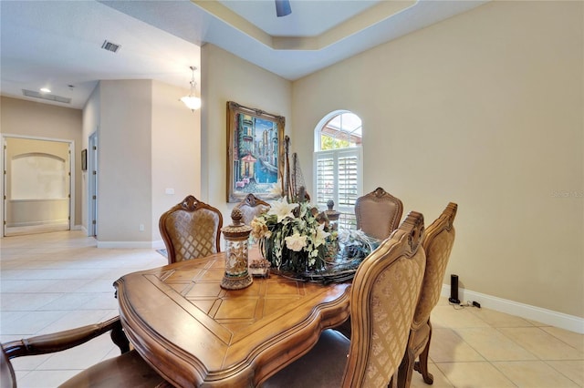 tiled dining room featuring ceiling fan