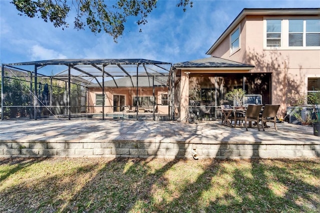 view of patio featuring a lanai and a wooden deck