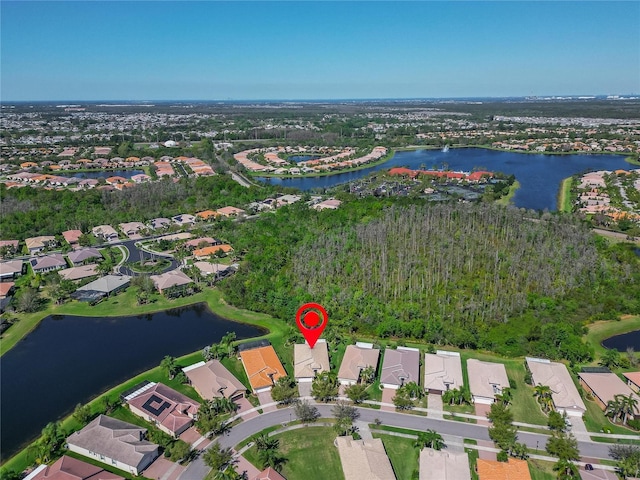 aerial view with a residential view and a water view