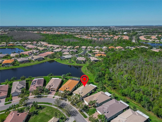 aerial view with a residential view and a water view