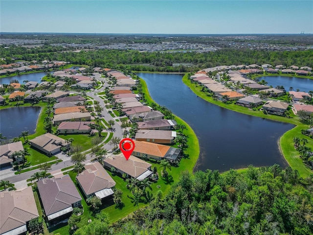 birds eye view of property featuring a residential view and a water view