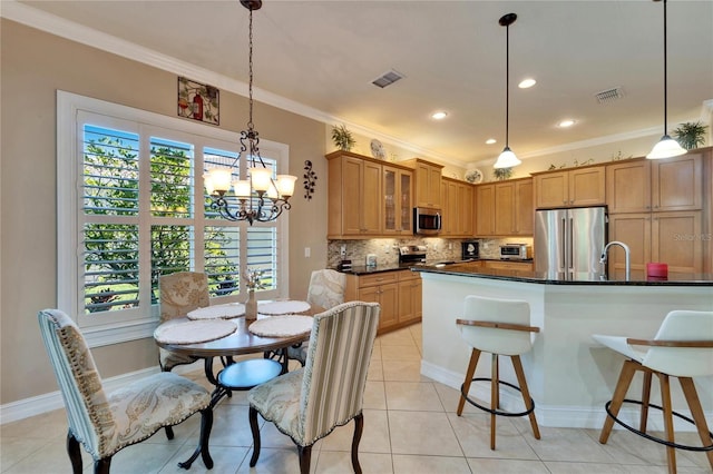 kitchen featuring decorative backsplash, glass insert cabinets, visible vents, and appliances with stainless steel finishes