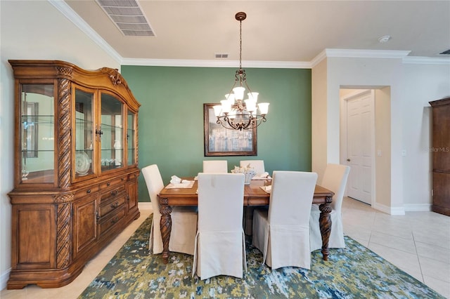 dining space with light tile patterned floors, visible vents, a notable chandelier, and crown molding